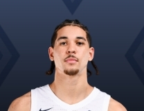 Malik Moore buries 3-point shot against Le Moyne Dolphins