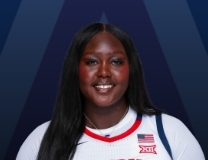 Achol Magot knocks down basket