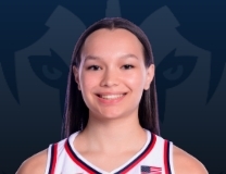 Kayleigh Heckel gets the hoop and harm for Huskies